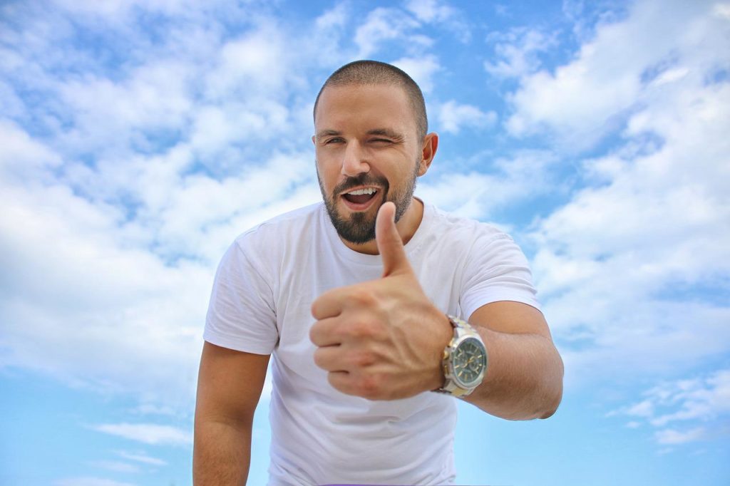 young man, blue sky, thumbs up-2939344.jpg